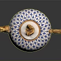 Elegant White Ceramic Teapot With Blue Leaf Pattern Golden Handle And Ornate Lid