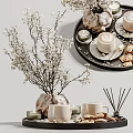 White Flower Branches in Decorative Vase with Coffee Mugs Cookies and Candles
