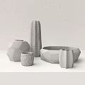 Elegant Decorative Vessels With Geometric Shapes And Metallic Tones On White Surface
