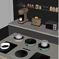 Modern Kitchen Countertop With Induction Cooktops Pots Coffee Maker Toaster And Microwave