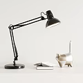 Black Desk Lamp With Adjustable Arm Bright Light Cat Figurine Open Book And Notebook