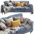 Cozy Blue Sofa Set with Soft Pillows and Furry Wool Blanket