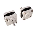 White Stepper Motors With Black Components And Metal Shafts For Industrial Use