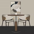 Modern Round Table And Two Chairs With Abstract Painting On Wall