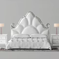Elegant Double Bed With Scalloped White Headboard And Nightstands With Table Lamps