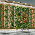 Green Plant Feature Wall With Decorative Metal Frame And Circular Emblem