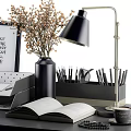Modern Office Desk Workspace With Black Lamp Vase Notebook Pens And Coffee Cup