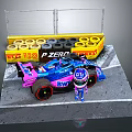 Blue And Pink Racing Car With Pit Figure Near Track Side Tire Wall