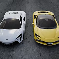 Two White And Yellow Sports Cars Parked Side By Side On Asphalt Road