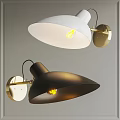 White and Black Wall Lamps With Gold Bases Funnel Shaped Shades And Lit Bulbs