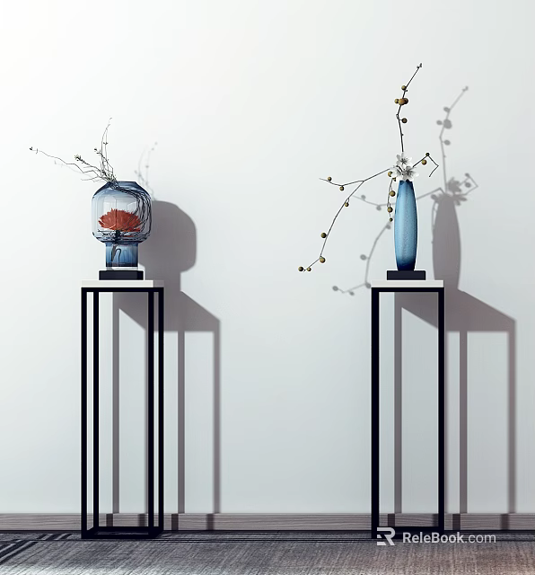 Blue and Red Vases with Flower Branches on Black Pedestals Against White Wall 3d model 