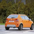 Orange Suzuki Ignis Parked Outdoors On Paved Area With Trees 3d model