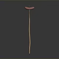 Long Wooden Handle With Two Pink Sweet Potatoes Isolated On Black Background With Reflection