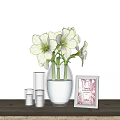 Transparent Glass Vase With White Flowers On Wooden Table With Photo Frame And Candles