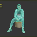 A Man Sitting On Cylindrical Stool Wearing Black Cap Gray Jacket And Blue Jeans