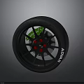 Car Wheel With Black Rim Red Bolts Green Brake Caliper And ADVAN Tire