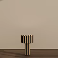 Modern Minimalist Table Lamp With Black And White Striped Lampshade And Base On Wooden Floor