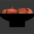 Vibrant Red Ripe Pomegranates Placed On A Black Plate For Fresh