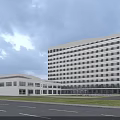 Modern Multi Storey Hospital Building With Glass Facade And Roadside Green Lawn