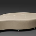Beige Upholstered Ottoman With Irregular Shape And Line Pattern On Metal Legs