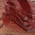 Ancient Cannon In Historical Stone Fortress With Brick Archway Structure