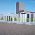 White Railings Along Modern Buildings With Blue Sky Green Grass And Gray Ground