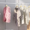 White Clothes Rack With Various Garments In Bedroom And Shoes On Shelf