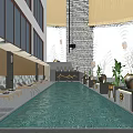 Modern Swimming Pool With Sun Loungers And Green Plants In Outdoor Modern Building Setting