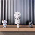 Decorative Ornament Set with Abstract Figurines on Wooden Shelf Vertical Striped Wall