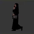 Woman in Black Abaya and Hijab Holding Small Handbag Against Gray Background