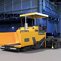 Caterpillar Yellow Industrial Paver With Cab And Tracks In Indoor Factory Setting