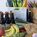 Assorted Fresh Foods And Beverages With Paper Bags