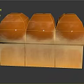 Three Orange Dome Shaped Pastry Desserts With Square Base And Smooth Glossy Surface