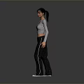 Child in Gray Long Sleeve Top Black Pants and White Sneakers Against Gray Gradient Background