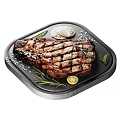 Grilled Steak On Black Plate With Rosemary Lemon Slices And Salt