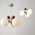 Modern Chandelier Design With White Spheres Red Accents And Silver Metal Frame For Interior Decor