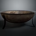 Vintage Metal Bowl With Textured Surface And Black Stand Legs On Dark Background