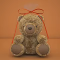 Brown Teddy Bear Doll in Transparent Packaging with Red Bow Decoration
