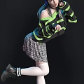 Stylish Woman In Green Black Striped Sweater With Blue Cat Ear Headphones And Plaid Skirt