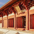 Traditional Chinese Ancient Architecture With Green Roofs Red Wooden Columns Stone Steps And Interior Statues