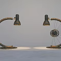Two Industrial Style Floor Lamps With Curved Arm And Bicycle Wheel Design