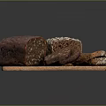 Fresh Whole Grain Bread Loaves With Seeds Sliced On Wooden Cutting Board