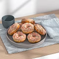 Tasty Glazed Donuts with Colorful Sprinkles on Wooden Table with Dark Cup and Blue Cloth