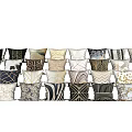 Diverse Patterned Pillows In Black White Beige And Brown Tones Arranged On Stairs