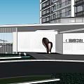 Modern Entrance Gate of Baylor Square Chateau With High Rise Building Green Plants and Sculpture