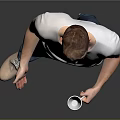 Man in Gray T-Shirt and Blue Jeans Holding White Cup Standing Against Simple Gray Background