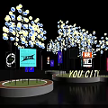 Illuminated Tree Like Decorations On Circular Bases With Colorful City Billboards