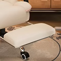 Comfortable Beige Office Chair With Black Armrests Wheels And Wooden Desk In Cozy Home Office