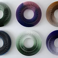 Stylish Spiral Circular Wall Decor With Multicolored Rings Arranged On White Background