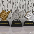 Three Golden Silver and Crystal Trophies with Black Bases and Engraved Team Recognition Text
